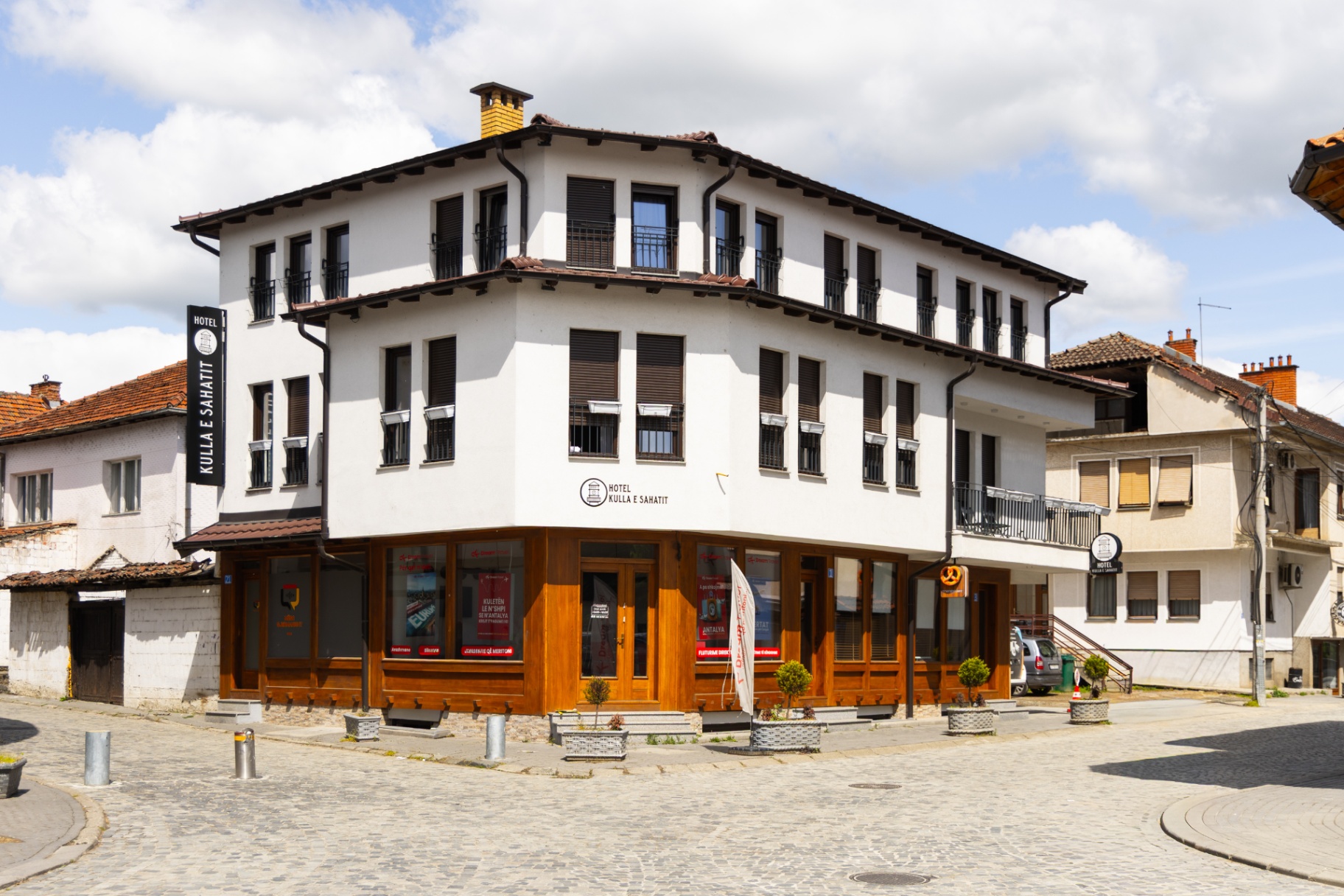 Hotel Kulla e Sahatit exterior on the cobbled street corner in the Old Bazaar of Gjakova